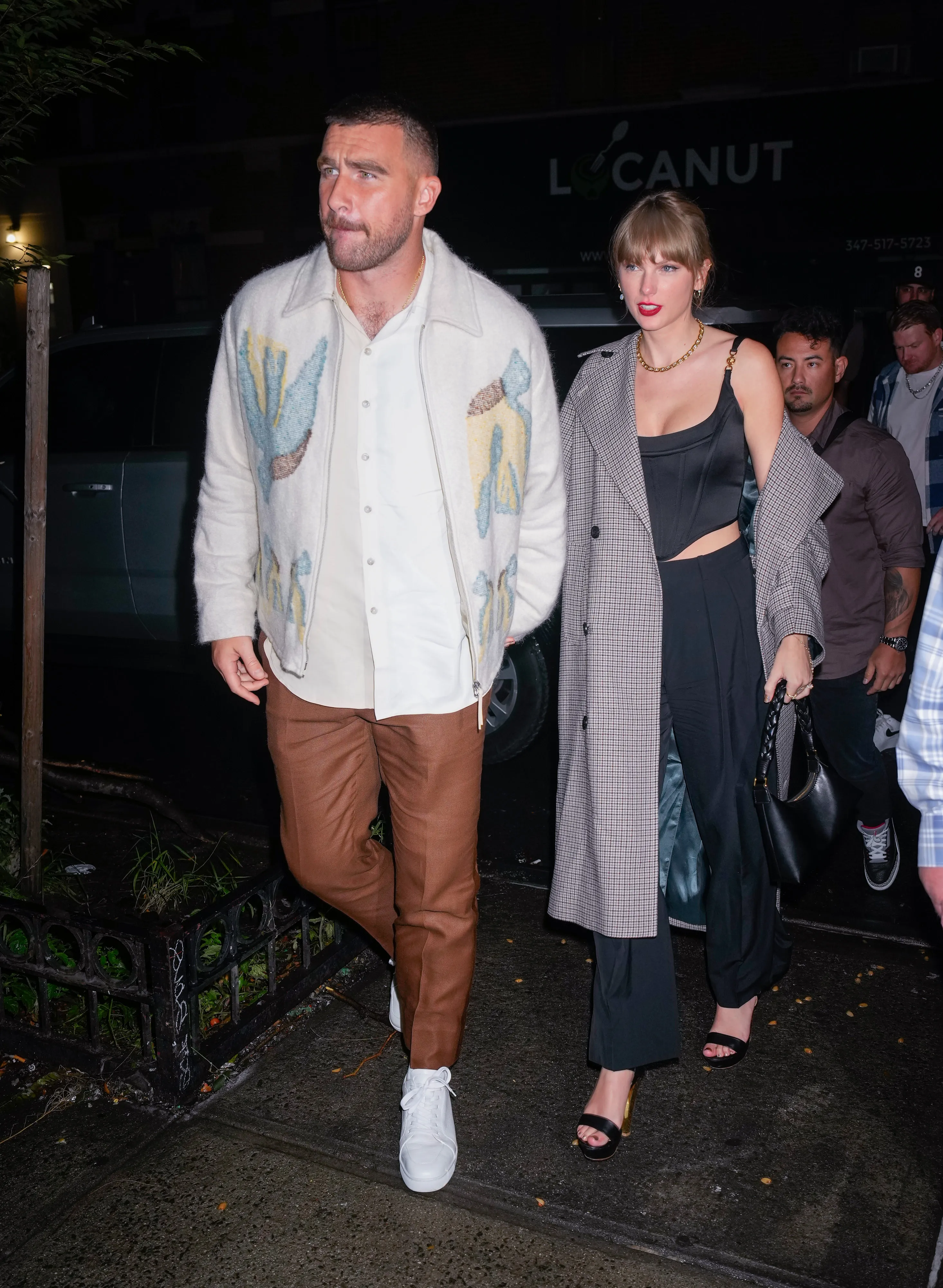 Travis Kelce and Taylor Swift arrive at an SNL afterparty.