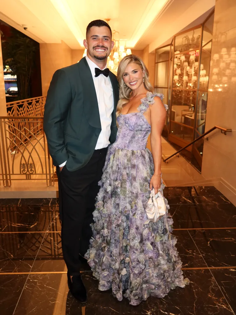 Drue and Jackie Tranquill, dressed in formal attire, pose indoors.