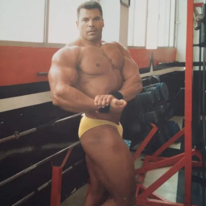 Bodybuilding champion Antonio Hernandez Torres posing in yellow briefs.