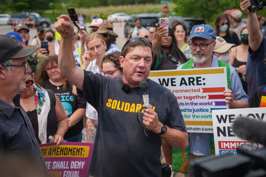 Troy Jackson speaking during a demonstration outside a federal immigration office in Maine.
