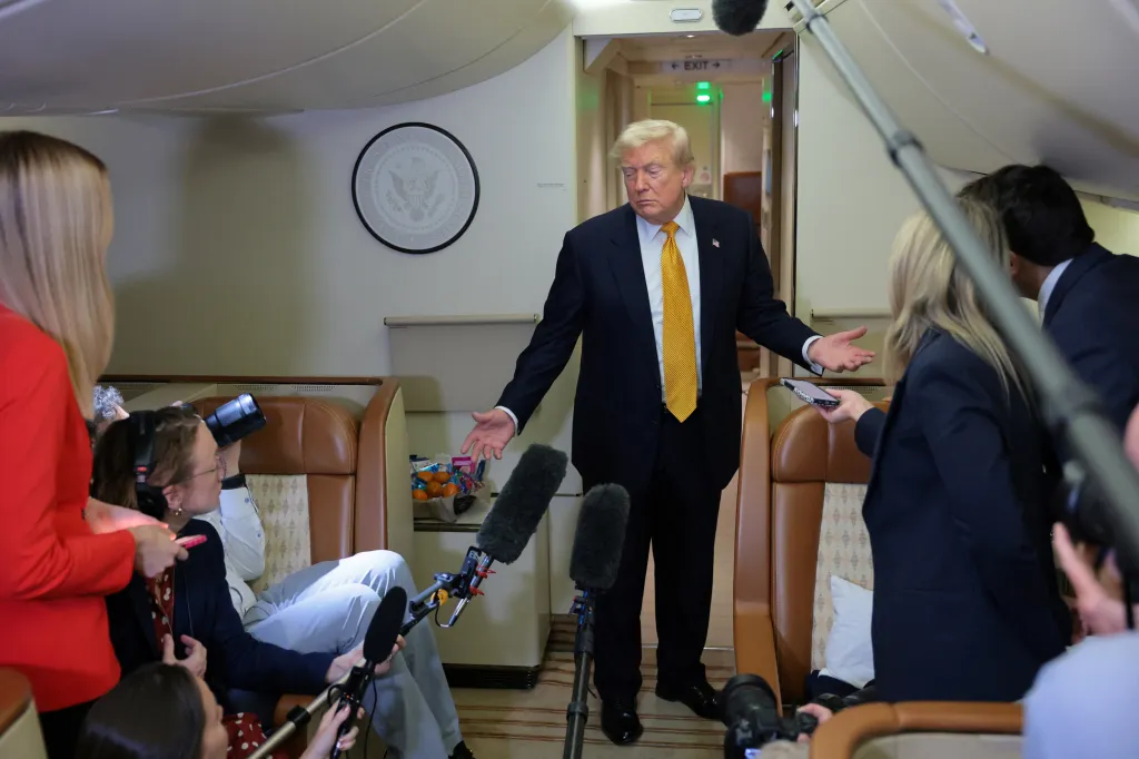 President Trump speaks to reporters mid-flight in the press cabin of the new, Qatari-gifted Air Force One after changing planes to return to Washington from RAF Mildenhall, Britain, July 8, 2026. 