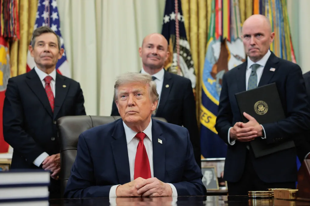 U.S. President Donald Trump, with Utah Governor Spencer J. Cox, takes questions from the media after signing an executive order related to Utah protected lands, in the Oval Office at the White House in Washington, D.C., U.S., July 13, 2026.