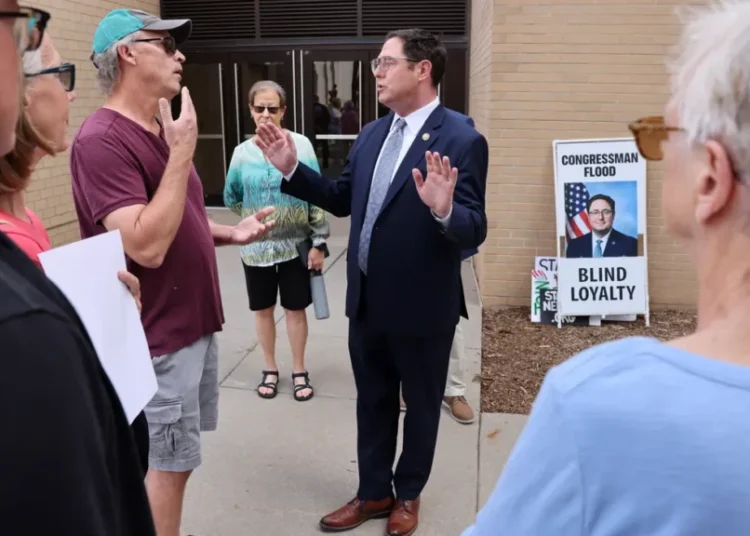 GOP lawmaker showered with boos from angry town hall attendees for supporting Trump bill