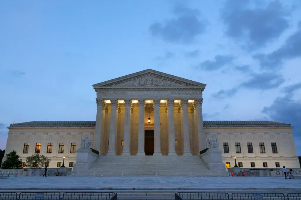 Exterior of the US Supreme Court building at dusk.