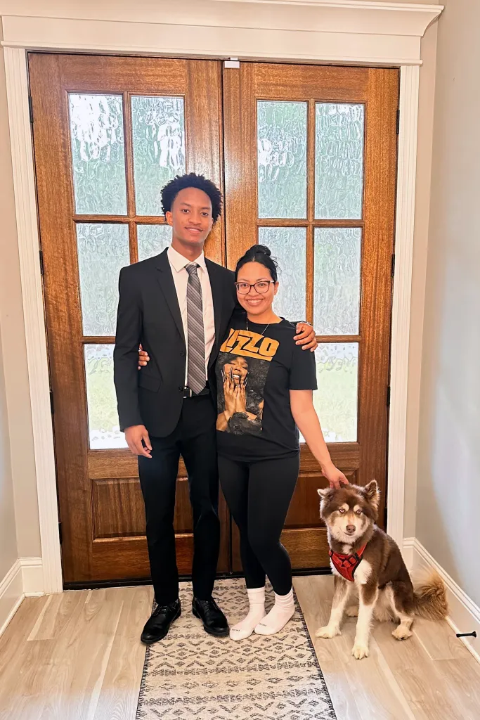 Nolan Xavier Wells and his mother, Christine Wonsley, with a dog.