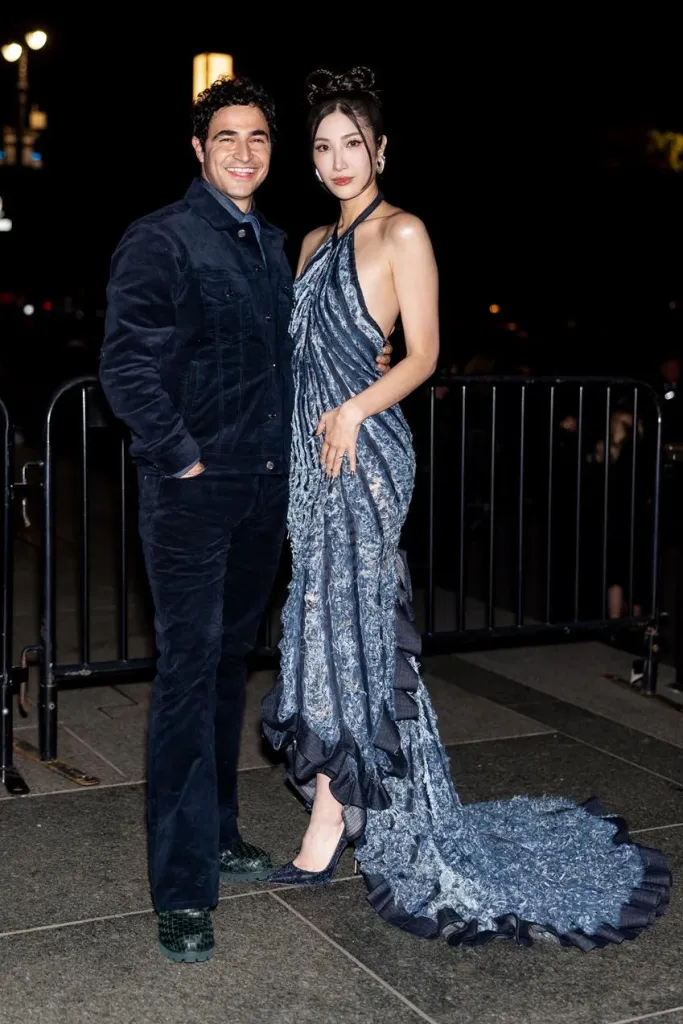 Designer Zac Posen and Ejae, wearing a Gap Studio distressed denim gown, attend the 2025 CFDA Awards. Source: Getty
