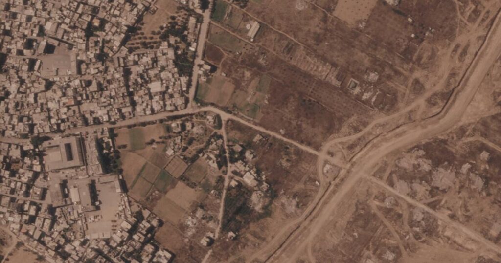 Israel is building a miles-long earthen barrier inside Gaza, entrenching its division