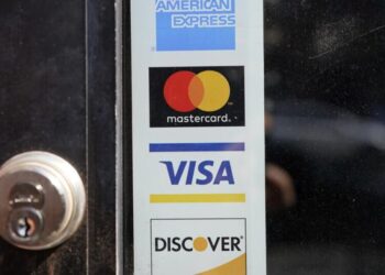Are businesses allowed to charge me to use my credit card?