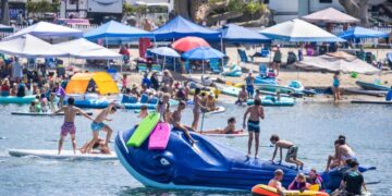 Some beachgoers are creating living rooms with a view on the sand. Cities are cracking down