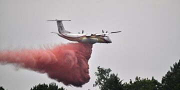 France says monster fire that forced 220,000 people to flee has stopped growing