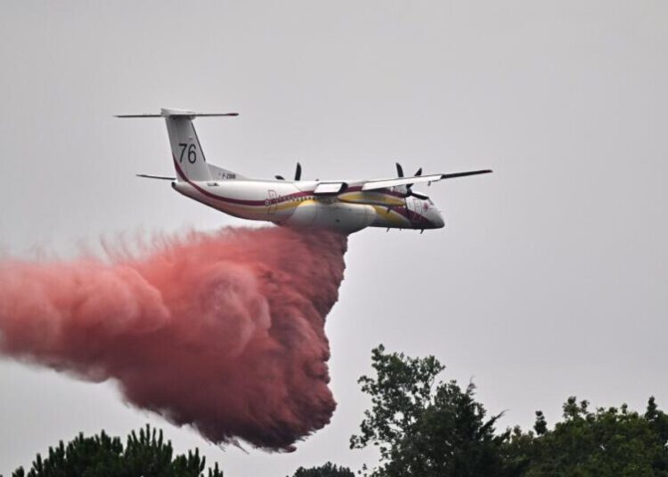 France says monster fire that forced 220,000 people to flee has stopped growing