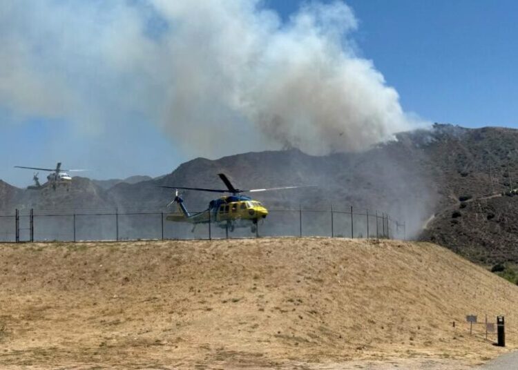 Evacuation warnings issued as more than 100 firefighters battle Lake Piru brush fire
