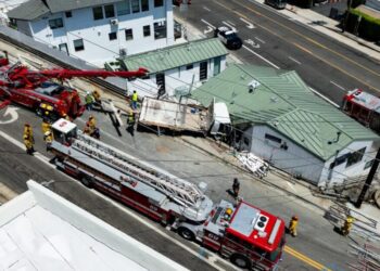 Fire crews rescue man trapped in truck that crashed into a Pacific Palisades building