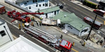 Fire crews rescue man trapped in truck that crashed into a Pacific Palisades building