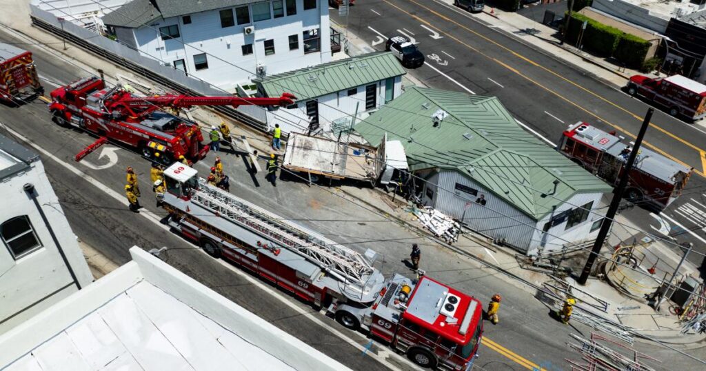 Fire crews rescue man trapped in truck that crashed into a Pacific Palisades building