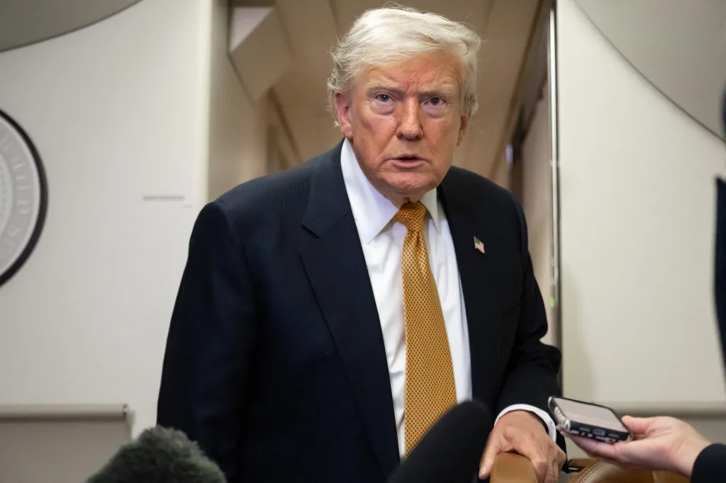 Donald Trump speaks to media on Air Force One.