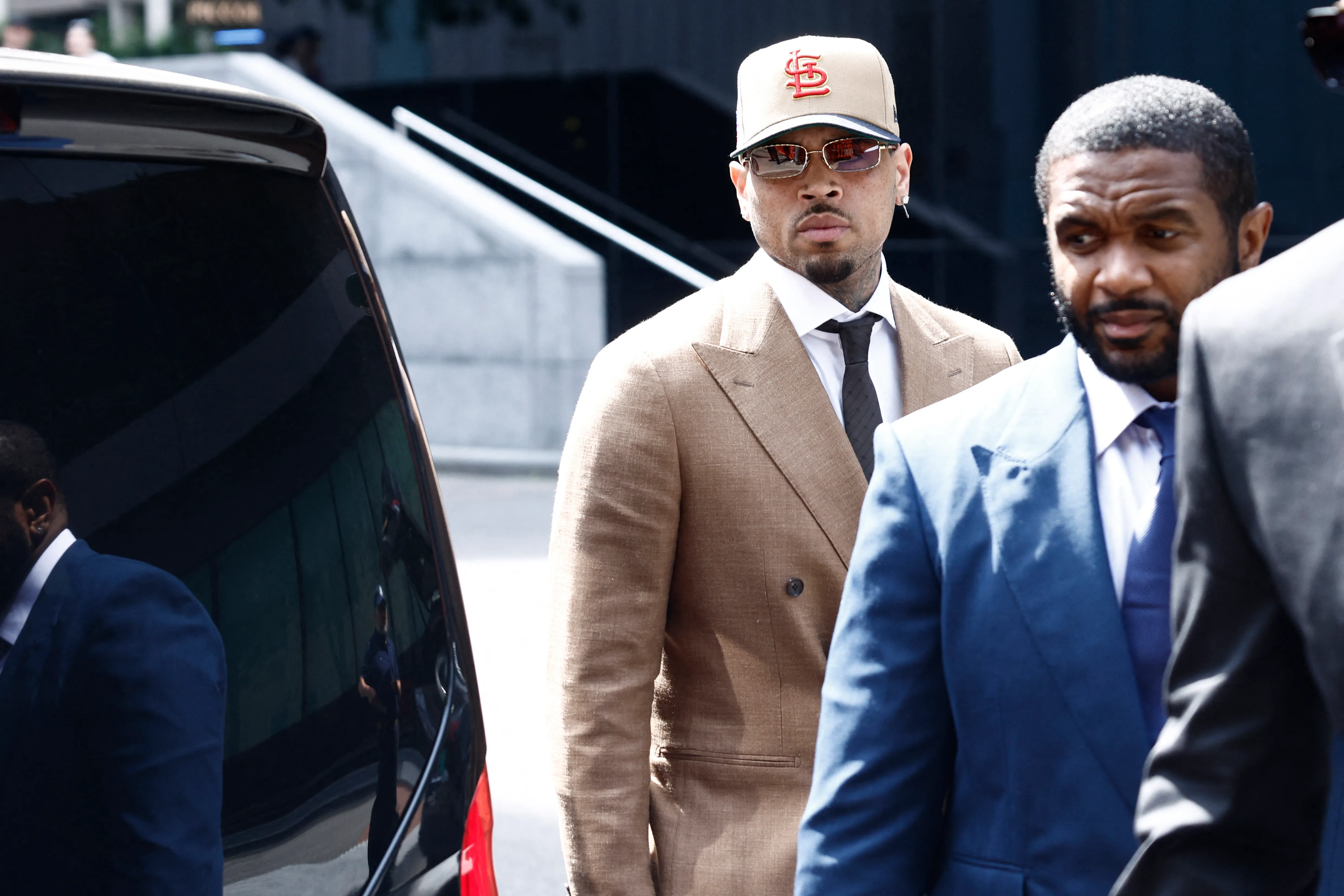 Chris Brown arrives at Southwark Crown Court in London on July 24