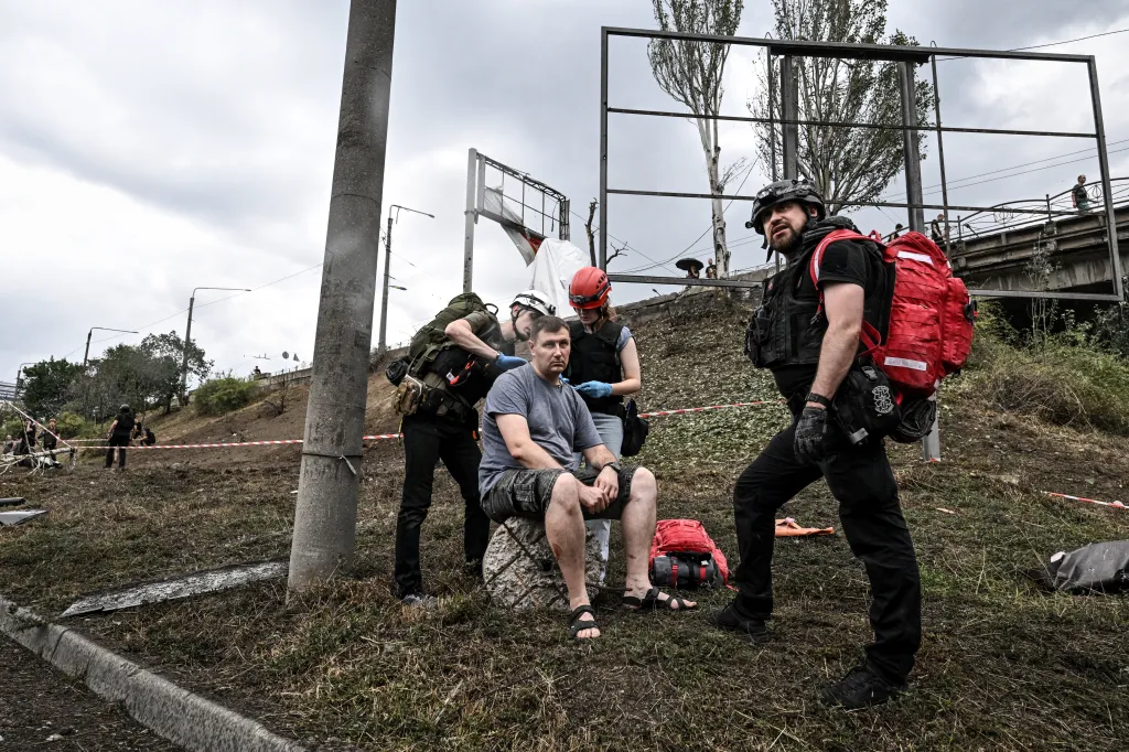 Paramedics administer first aid to an injured man after a Russian air strike in Zaporizhzhia, Ukraine.