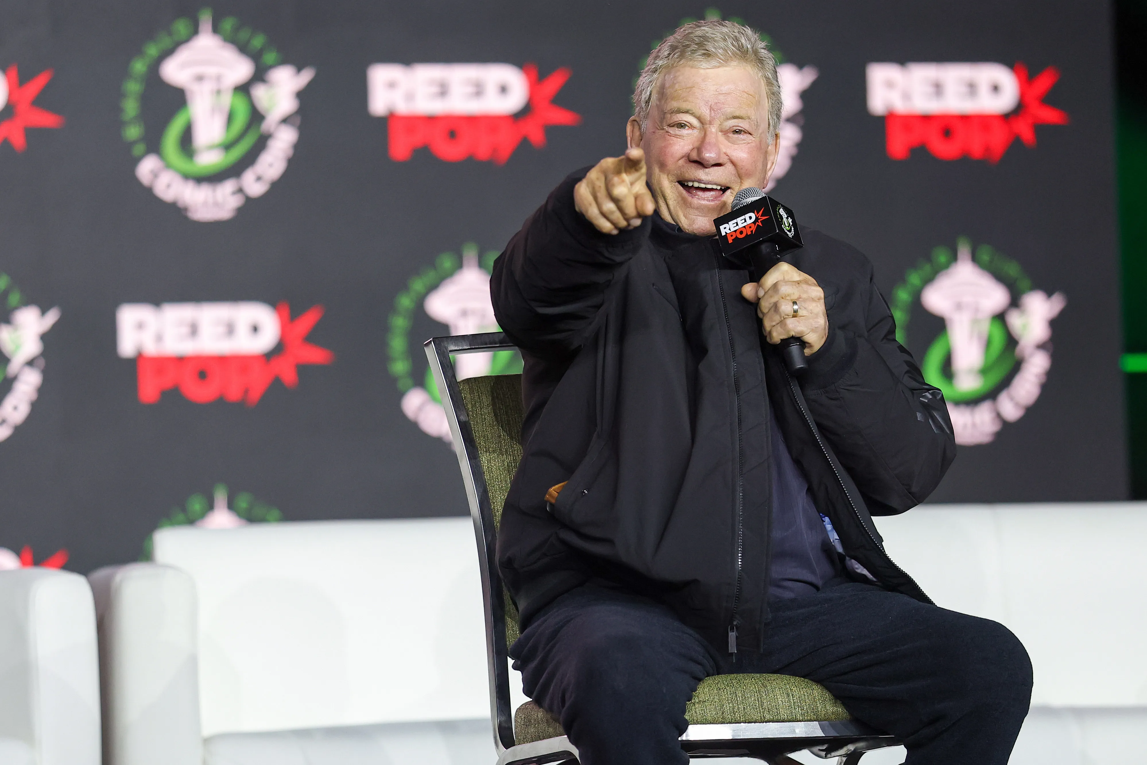 William Shatner speaking onstage during a panel at Emerald City Comic Con.