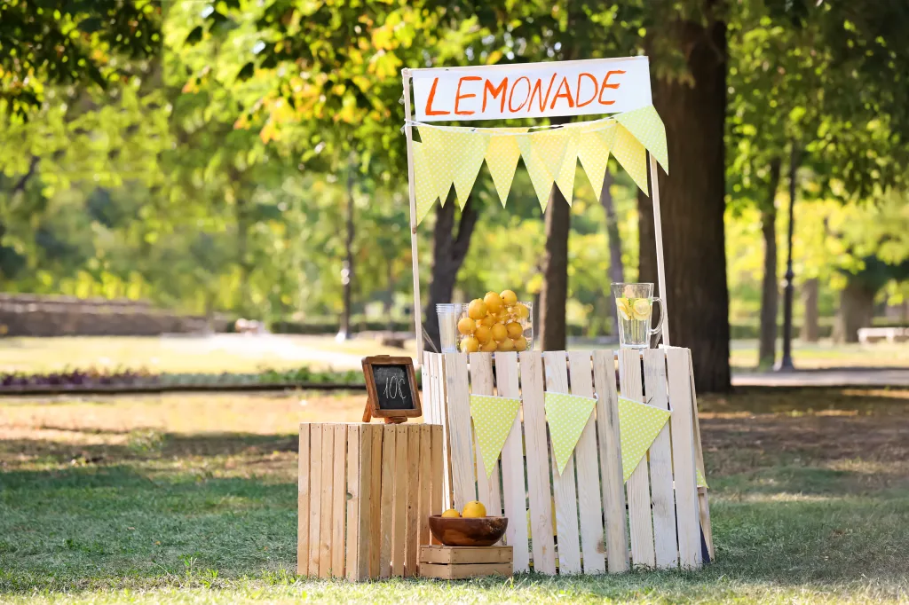 A wooden lemonade stand with a 
