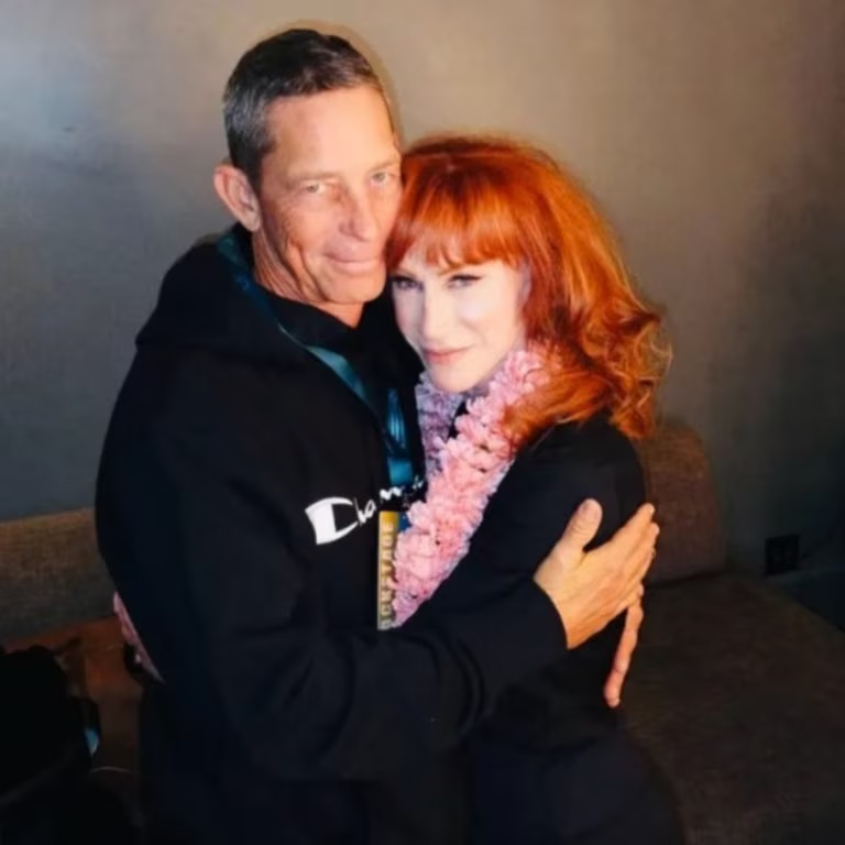 Kathy Griffin posing with an unknown man.