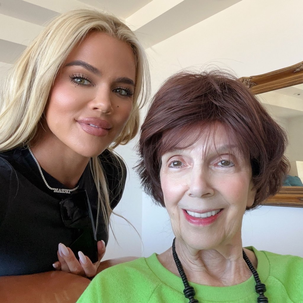 Khloe Kardashian posing with her grandmother, MJ, who is wearing a bright green top.