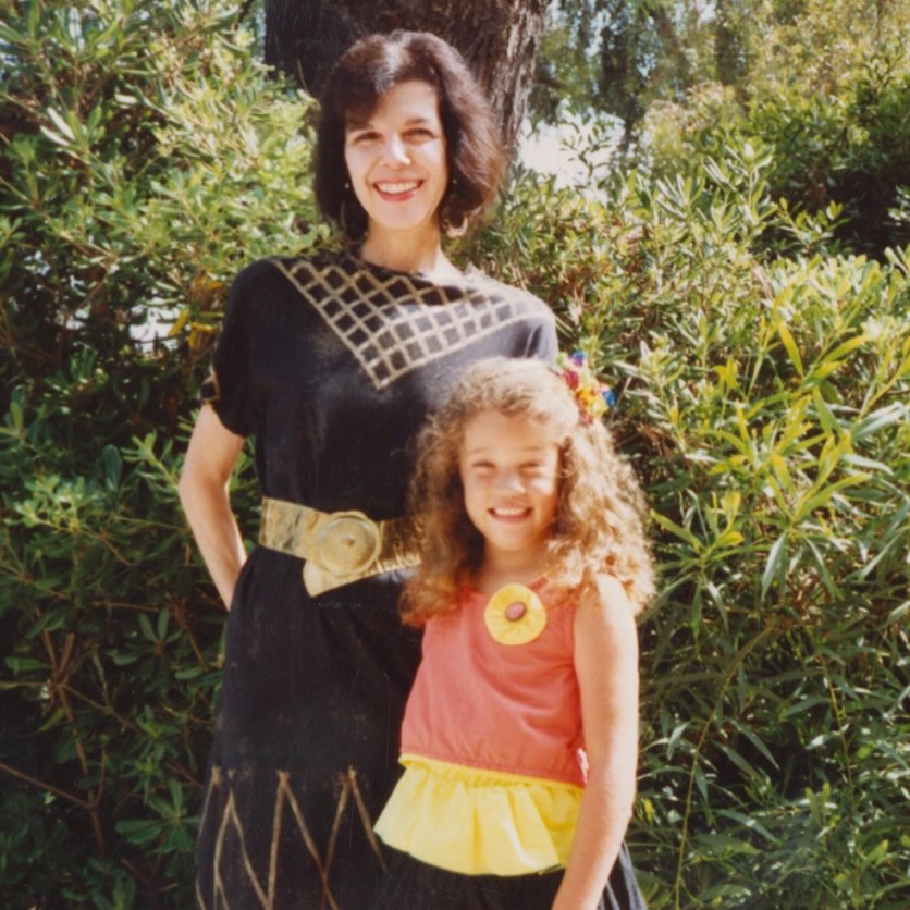Khloe Kardashian and her grandmother MJ in a black dress with a golden belt.