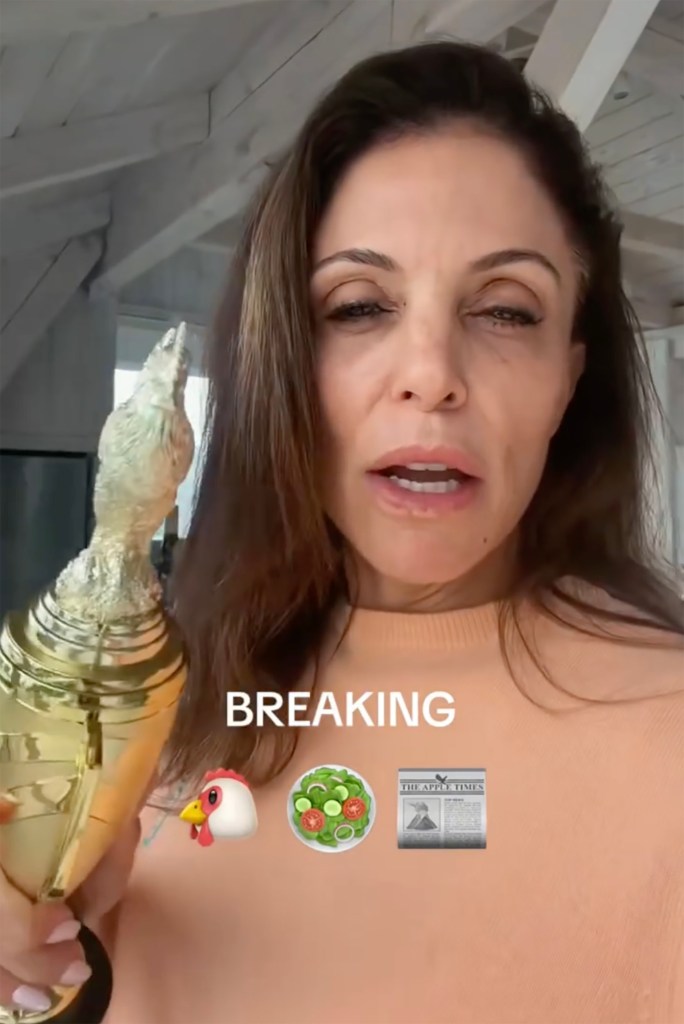 Bethenny Frankel holding a golden chicken trophy with 