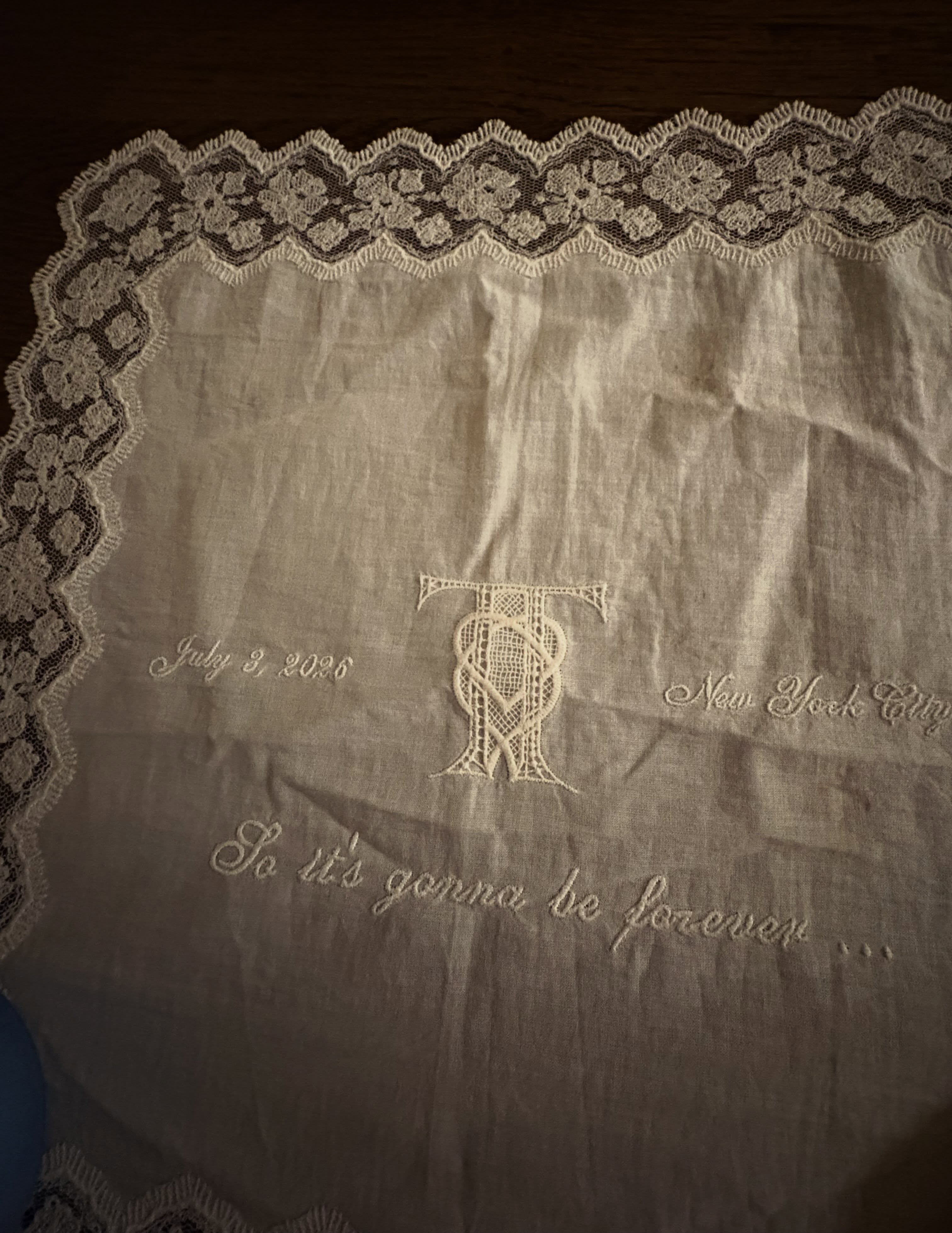 White cloth embroidered with a 