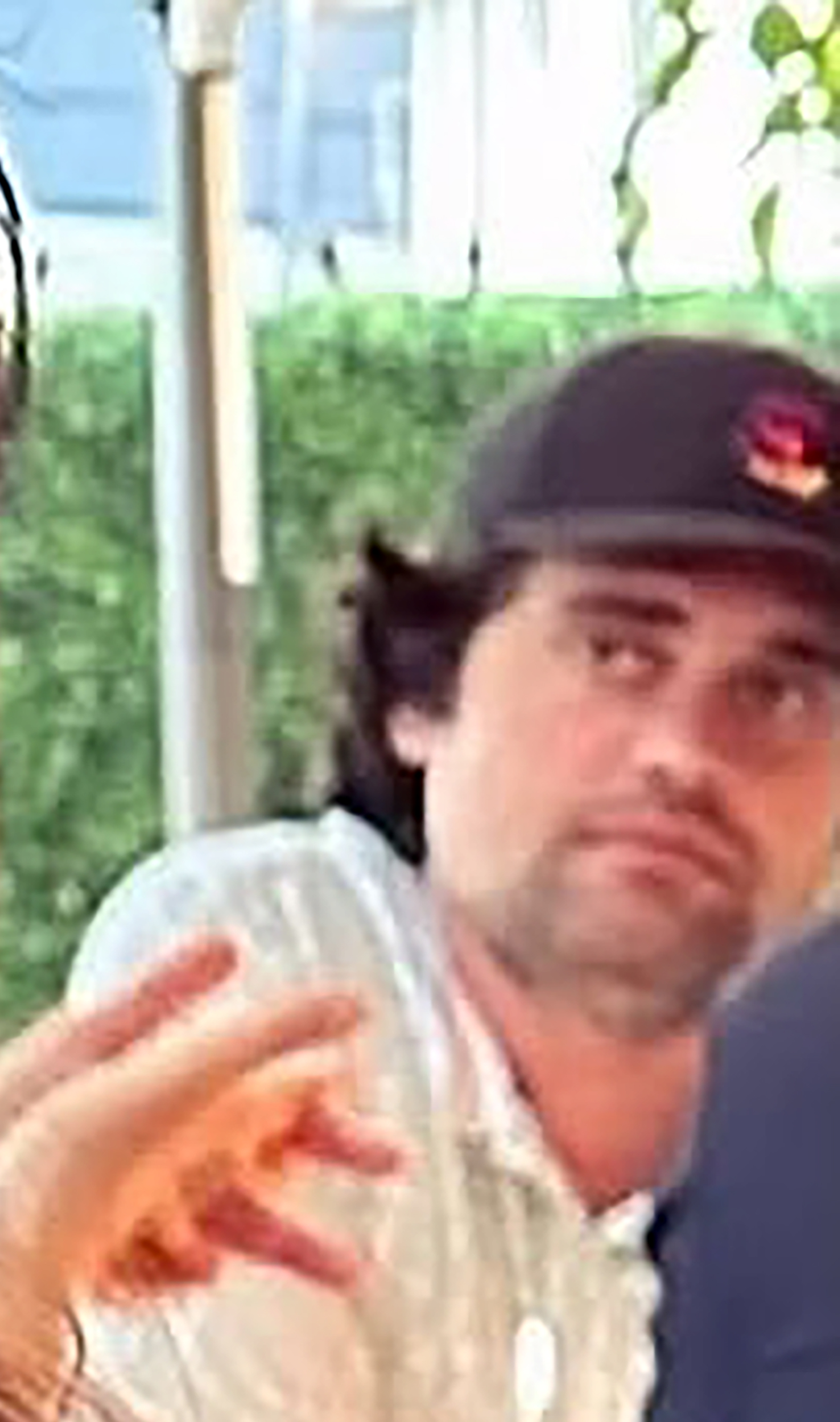 Nick Reiner in the background of a photo.
