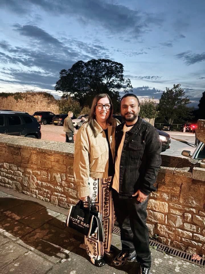 Jenny Slatten and Sumit Singh smiling for a photo.