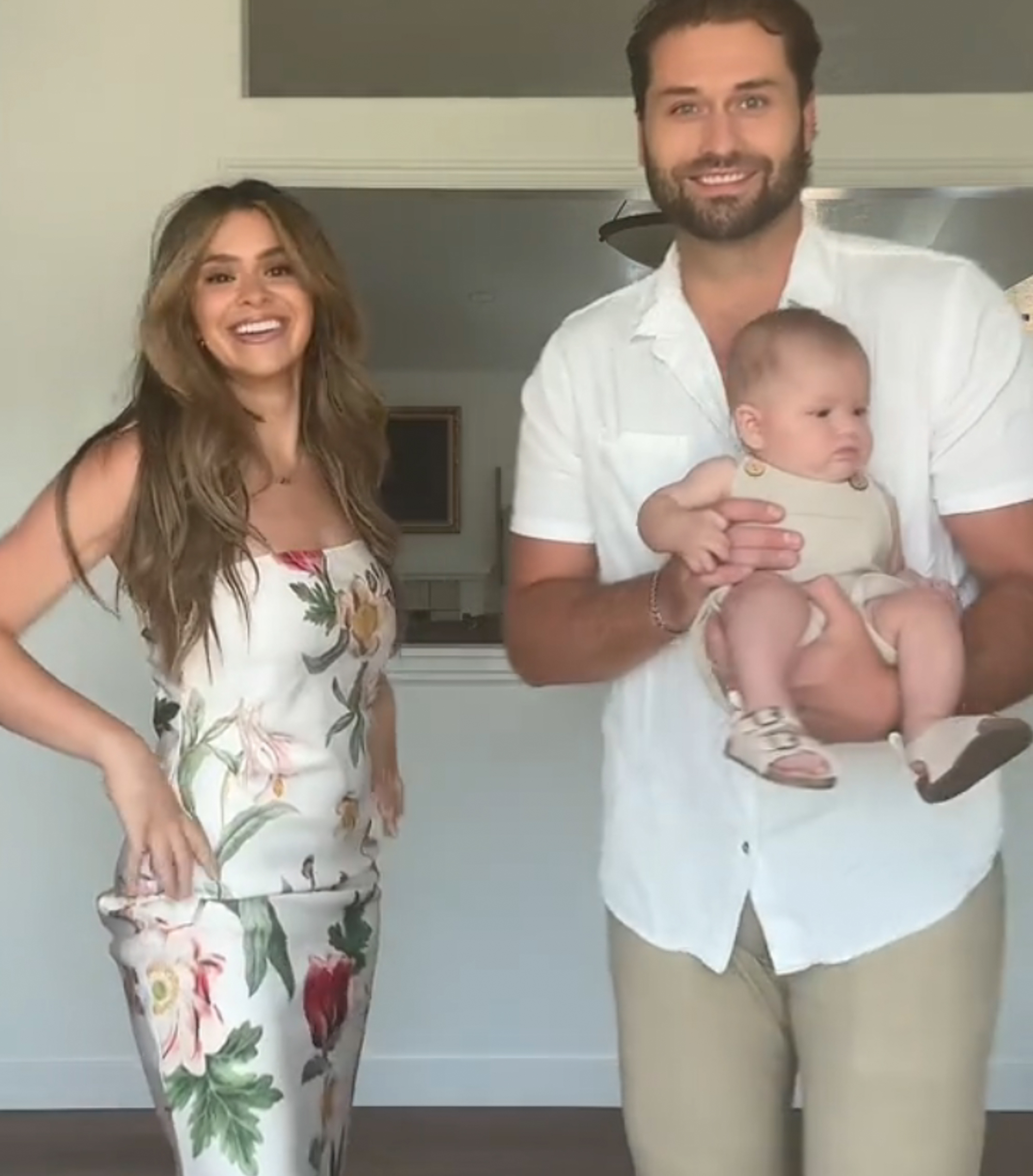 Taylor Frankie Paul and Dakota Mortensen posing with a baby.