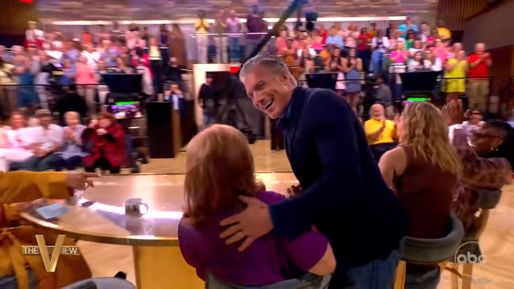 Anson Mount hugging and kissing Joey Behar on 