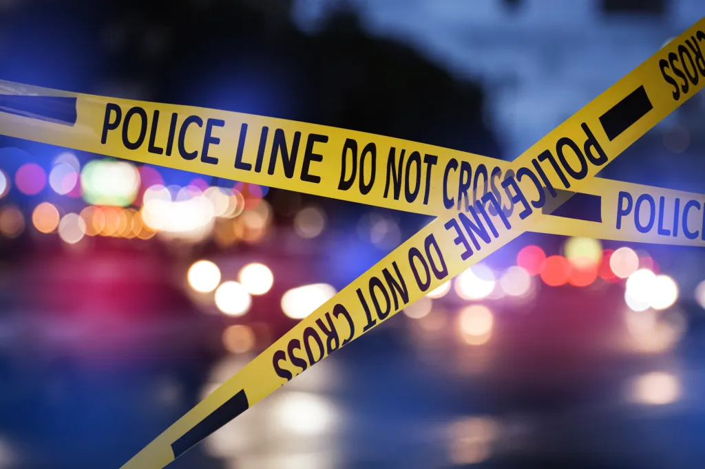 Yellow police tape reads 