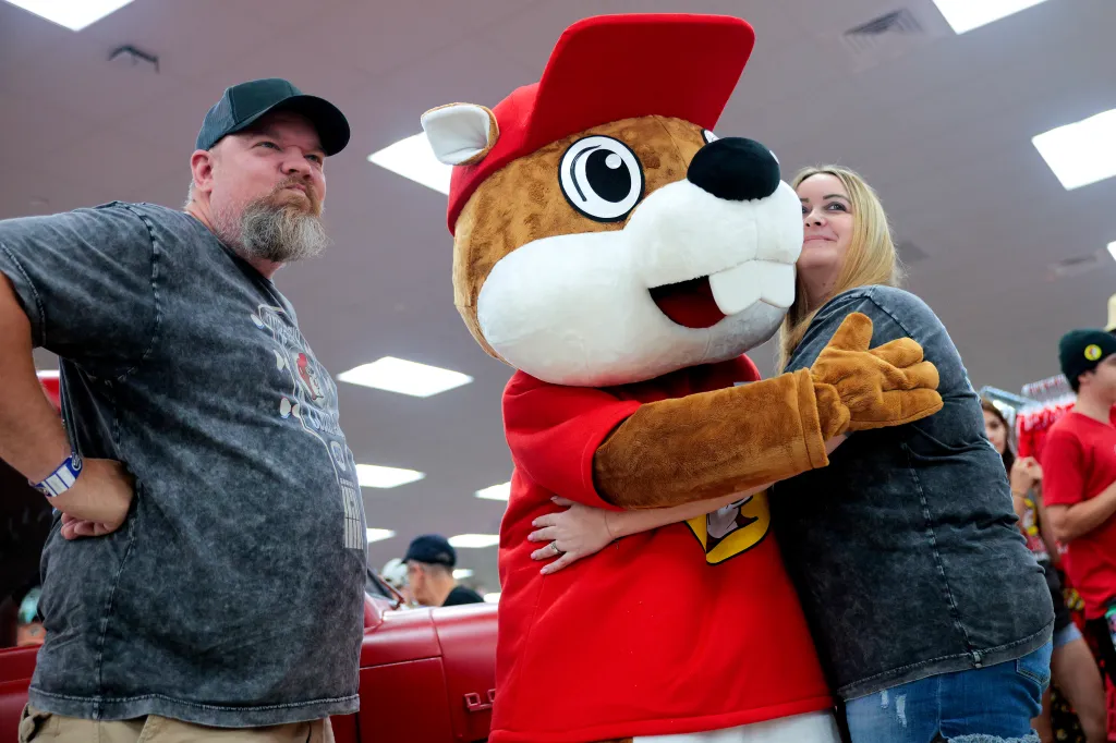 Customers take photos with the Buc-ee's mascot at the grand opening of the first Buc-ee's on the East Coast.