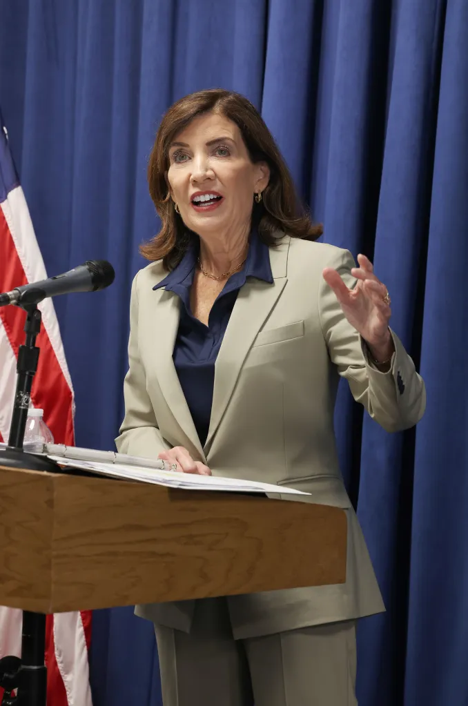 New York Gov. Kathy Hochul speaking at a podium.