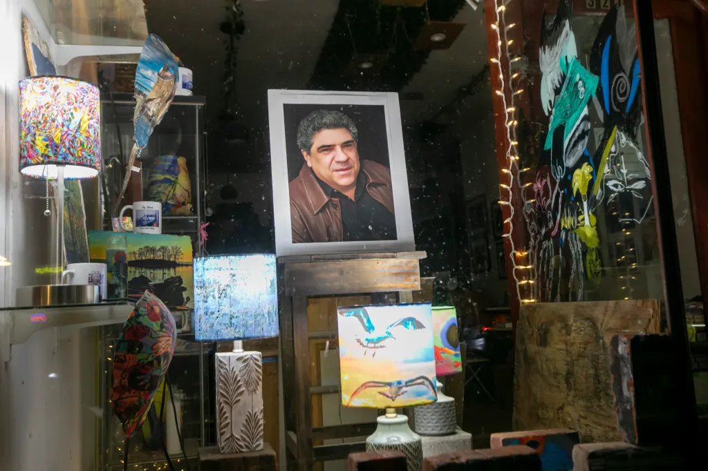 A framed portrait of Vincent Pastore on display in the window of the Focal Point gallery.