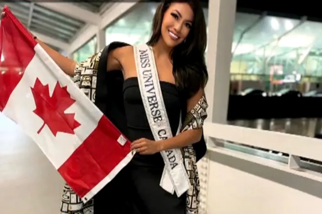 Miss Universe Canada 2023 with a Canadian flag.