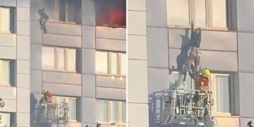 Harrowing video shows woman take death-defying leap from 11th-floor of burning high-rise building
