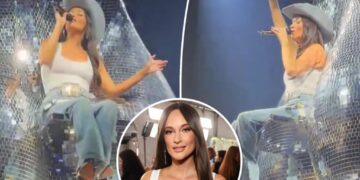 Kacey Musgraves sings atop giant ‘disco balls’ during cheeky tour performance