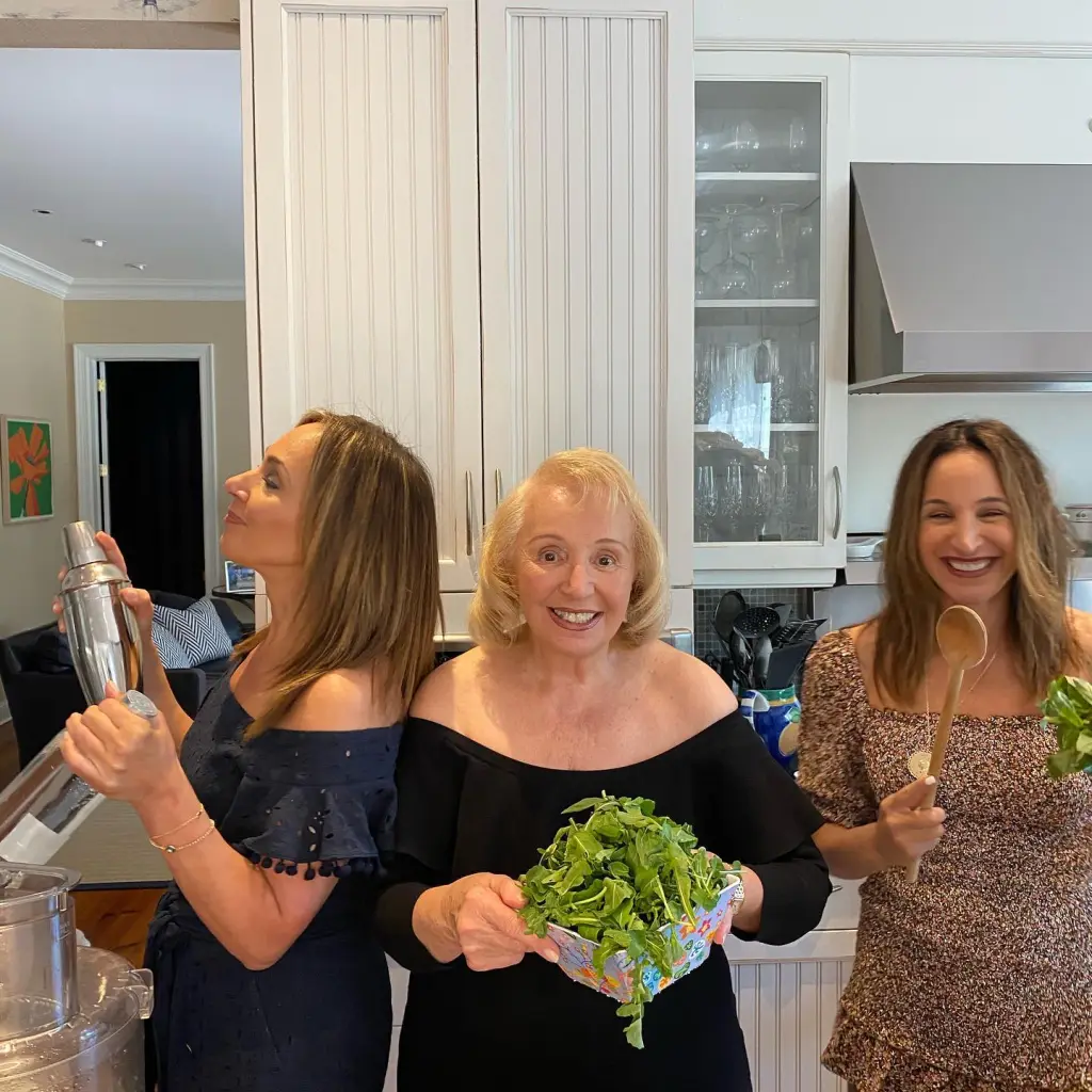 Rosanna Scotto with her sister Eliana and mother Marion posing with kitchen items.