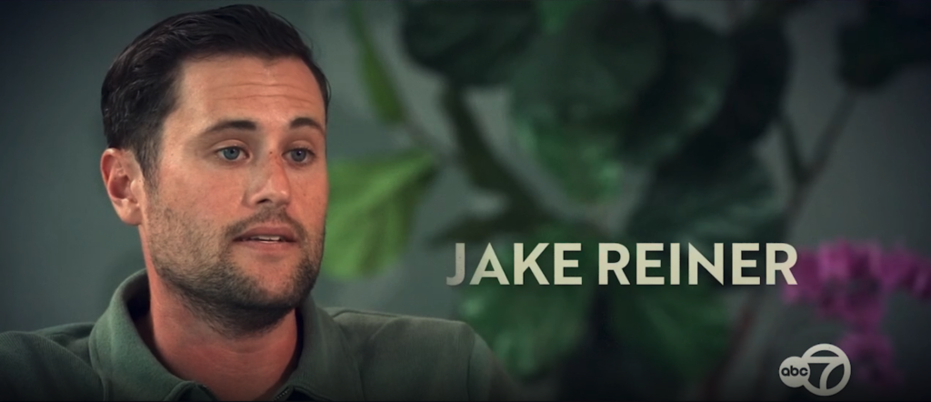 Jake Reiner, a white man with dark hair and a beard, in a green polo shirt.