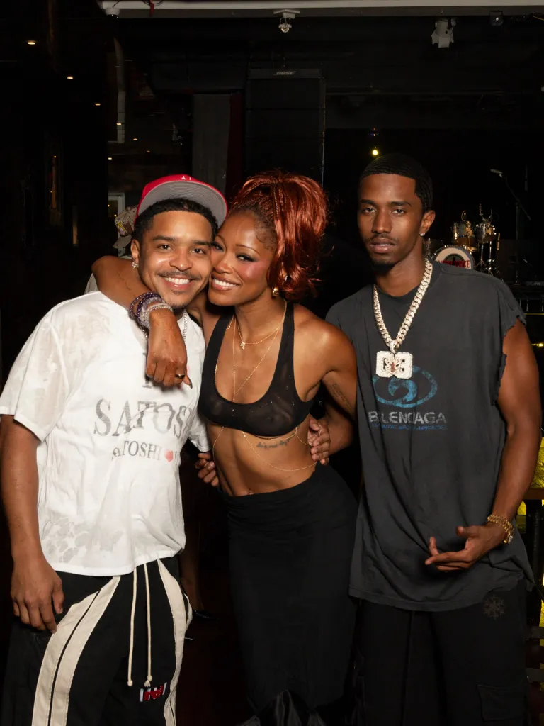 Keke Palmer posing with a male friend and brother, Darius Daulton, at her birthday party.