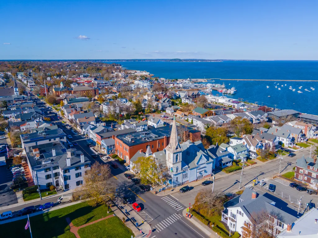 Aerial view of the Spire Center for Performing Arts and surrounding Plymouth, Massachusetts during fall.