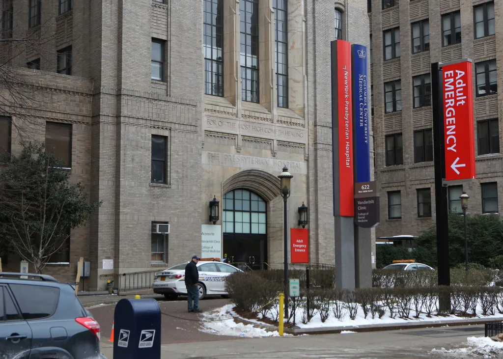 Columbia Presbyterian Hospital on West 168th Street and Broadway in New York, with a Public Safety car and signs for Adult Emergency.