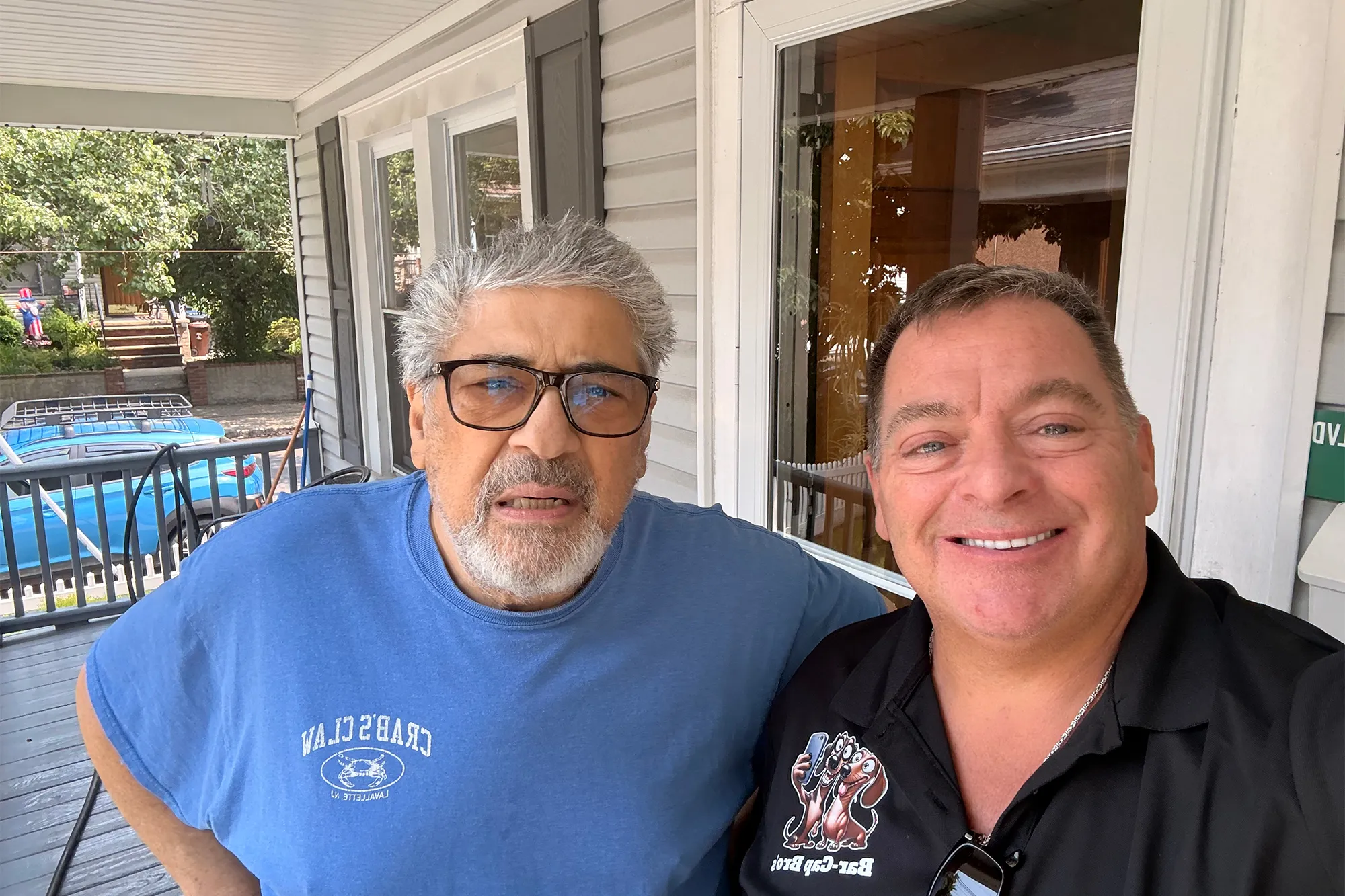 Vincent Pastore posing for a photo on a porch.