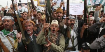 Iran-backed Houthi rebels attack crucial Red Sea port and Saudi Aramco refinery as fighting escalates