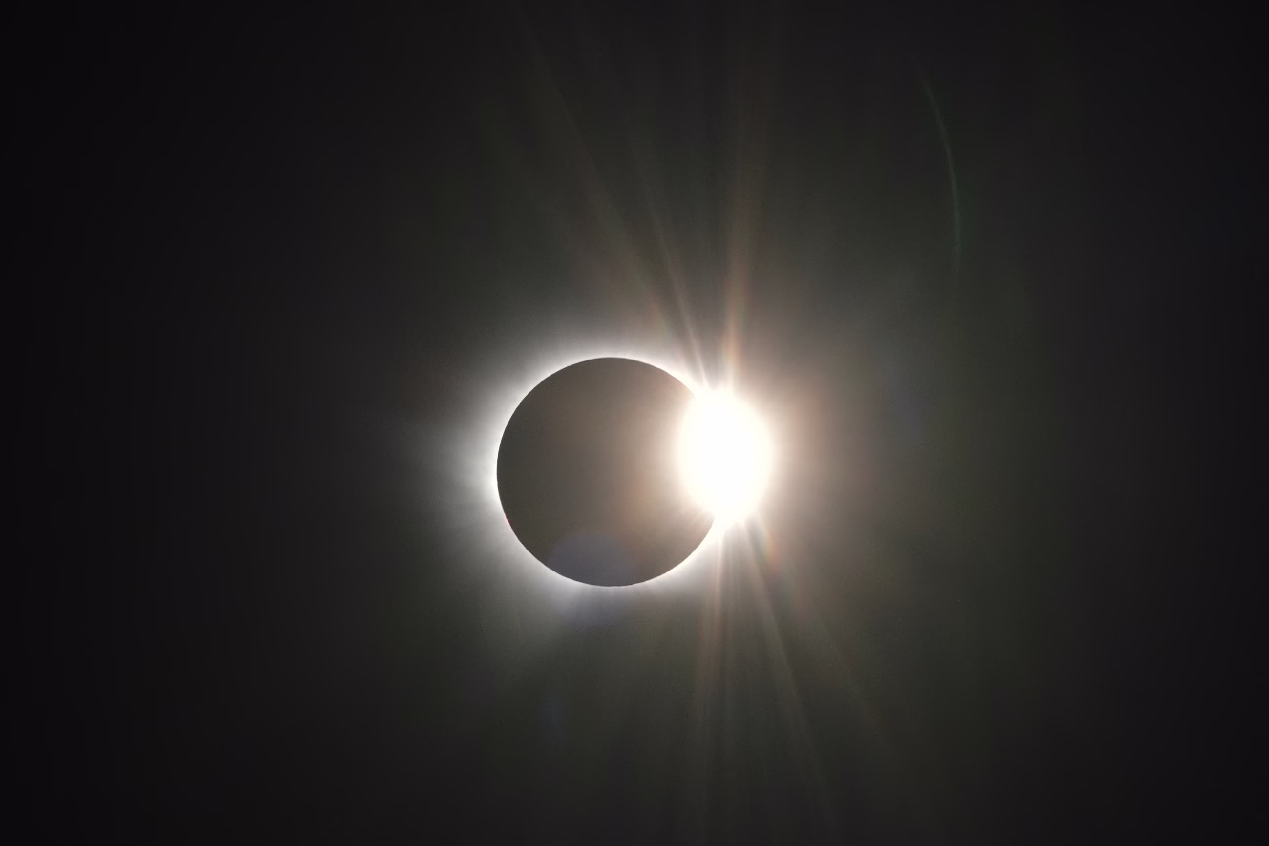 The sun, almost completely obscured by the moon.