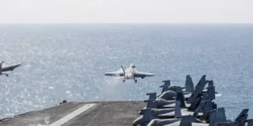 Sailors reportedly hurl themselves overboard the USS Abraham Lincoln