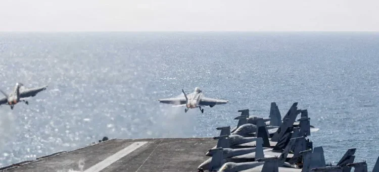 Sailors reportedly hurl themselves overboard the USS Abraham Lincoln